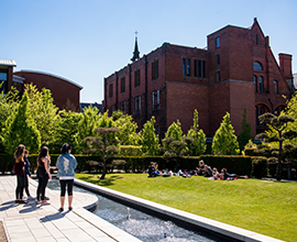 creative campus gardens, with some students walking around